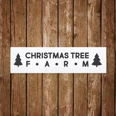 christmas tree farm sticker on the side of a wooden fence