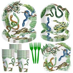 an assortment of green and blue plates with lizards on them, including forks, napkins, and spoons