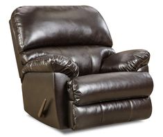 the reclining chair is brown and has two pillows on it's back end