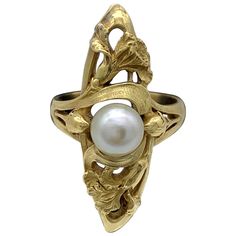 This finely modelled and extremely rare French Art Nouveau ring features two entwined irises and two flower buds surrounding a fine white oriental pearl. This elegant and harmoniously designed piece of jewellery is beautifully chiseled, solid and a tribute to the Art Nouveau movement. US ring size 7.35 Eu ring size 55.5 White Art Nouveau Jewelry For Anniversary, White Art Nouveau Jewelry For Formal Occasions, Art Nouveau Jewelry Ring, Bijoux Art Nouveau, Art Nouveau Ring, Arts Magazine, Art Nouveau Antiques, French Art Nouveau, Iris Flower