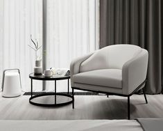 a living room with two white chairs and a coffee table in front of the window