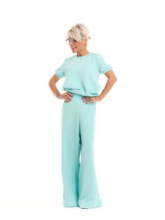 Refresh your casual wardrobe with our eye-catching blue set. The playful back panel lends a romantic touch to this sweatsuit set, making it a perfect option for days when you want to look cute and comfy. FEATURES:A blue sweatsuit set with a pleated tulle panel at the back. The top has short puff-sleeves. The bottoms have an elastic waistband and functional side pockets.100% Handmade. SIZE & FIT: Fit: A relaxed fit with room to moveModel is wearing size Small or S/M View our SIZE CHART before ordering MATERIALS & CARE: Content: Viscose Care: Machine wash on cold (30ºC) with a mild detergent. SHIPPING: Made to order, processing time is 15 working days This item will be shipped via DHL Chic Blue Loungewear Sets, Chic Blue Sets For Loungewear, Blue Sweatsuit, Lounge Suit, Pleated Tulle, Set Clothes, Sewing Clothes Women, Sweatsuit Set, Brand Magazine