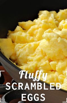 scrambled eggs in a skillet with text overlay that reads, fluffy scrambled eggs