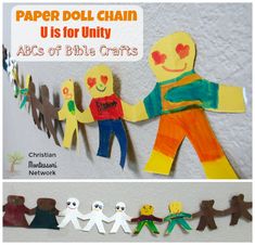 paper doll chain made to look like children holding hands and standing next to each other