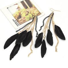 Light weight and trendy. Black feathers on gold and black chain-links. Coordinate these earrings with a boho inspired outfit. Order today and enjoy fast shipping. Bohemian Black Chain Jewelry, Elegant Black Feather Jewelry, Black Tassel Earrings For Party, Bohemian Black Feather Earrings, Black Bohemian Tassel Earrings For Party, Black Feathered Jewelry For Party, Black Feather Jewelry For Party, Black Chain Dangle Earrings, Black Dangle Earrings With Chain