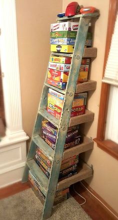 an old ladder is used as a bookshelf to hold children's books