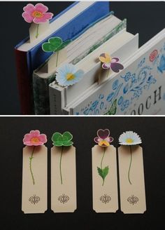 three bookmarks with flowers attached to them, and one has an open book in the middle