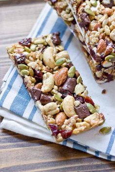 two pieces of granola bars sitting on top of a blue and white dish towel