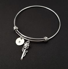 Personalized Antique Silver Rose Bangle Bracelet!  A detailed rose charm on an expandable bangle bracelet makes the perfect gift for you or your best friend.The rose bracelet charm is made from zinc alloy and measures 26 mm by 9 mm.  The bangle bracelet is high quality stainless steel and fits a wrist sized 6-8".  The flower bangle bracelet is personalized with a .5" silver plated disc stamped with the initial of your choice.  The charm and initial disc are connected to the bangle with sturdy sp Big Sister Bracelet, Rose Gold Nose Ring, Flower Charm Bracelet, Bible Verse Bracelet, Nose Ring Jewelry, Mom Necklace Personalized, Sister Bracelet, Bracelet Initial, Gold Nose Rings