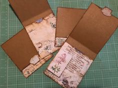 four pieces of brown paper with flowers on them