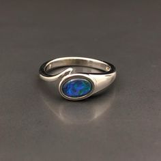 Natural Australian black Opal triplet Sterling Silver Ring, one-off piece of natural opal set in sterling silver in a modern design.  💎 Main Gemstone: Natural Australian Black Opal 💎 Material: Solid British Sterling Silver with rhodium plating.  Please note: All my Australian Opals are one-off pieces so some rings will need to be resized to your size once we receive your order, please allow 4-5 working days for us to resize for you.  The current size for this ring is US 7, UK O. It's free of c Formal Sterling Silver Opal Birthstone Ring, Silver Opal Ring With Polished Finish, Formal Silver Opal Birthstone Ring, Oval Cabochon Opal Ring Gift With Polished Finish, Opal Gifts, Blue Fire Opal, Australian Black Opal, October Birthday, Ring Men