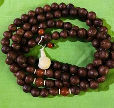 This prayer bead is real Bodhi  seeds and  old and used. This Prayer beads has a beautiful guru bead and real jade decoration beads. It is nice and good Bodhi seeds and perfect for counting mantras. This Bodhi prayer bead is 30 inches long. Traditional Brown Mala For Meditation, Traditional Brown Mala For Rituals, Traditional Handmade Mala For Meditation, Traditional Brown Mala As Gift, Spiritual Wooden Beads For Puja, Traditional Brown Beads For Meditation, Traditional Large Beads Mala For Meditation, Traditional Mala With Large Beads For Meditation, Spiritual Wooden Beads Mala For Puja