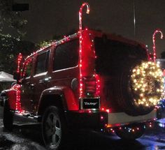 a jeep decorated with christmas lights and decorations