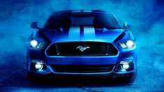 the front end of a blue mustang car