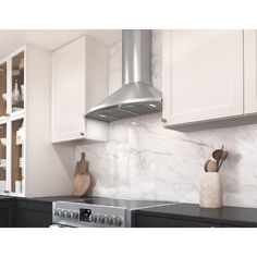 a stove top oven sitting inside of a kitchen next to white cabinets and counter tops