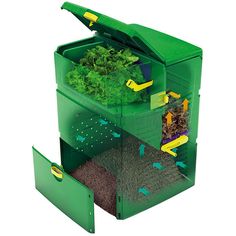 an image of a green box with vegetables in it's bottom section and the lid open