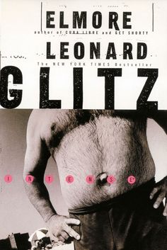 a man with no shirt holding a skateboard in front of his stomach and the words elmore leonard glittz on it