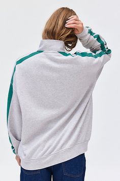 Varsity-inspired pullover sweatshirt featuring Florence, Italy graphics across the front. Designed in an oversized, slouchy fit with a half-zip neckline, drop shoulders and long sleeves with stripe graphics for that sporty vibe. Only at Urban Outfitters. Features Florence graphic half zip pullover sweatshirt Slouchy pullover sweatshirt Midweight knit Half zip v-neckline Drop shoulders and long sleeves with stripe graphic Florence, Italy 98 graphics across the front Ribbed knit banded hem Slouchy Oversized Half-zip Sporty Sweater, Sporty Oversized Half-zip Sweater, Oversized Half-zip Top With Ribbed Cuffs, Sportswear Sweatshirt With Funnel Neck, Sporty Half-zip Sweater, Sporty Funnel Neck Top With Ribbed Cuffs, Sporty Tops With Funnel Neck And Ribbed Cuffs, Long Sleeve Sports Tops With Contrast Stripes, Sporty Funnel Neck Top For Loungewear