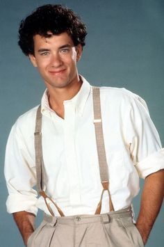 a man wearing suspenders and a white shirt