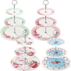 six plates with floral designs hanging from hooks