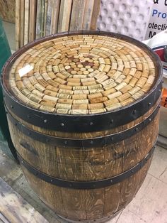 a large wooden barrel sitting on top of a floor