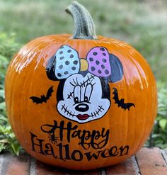 a mickey mouse pumpkin with the words happy halloween painted on it