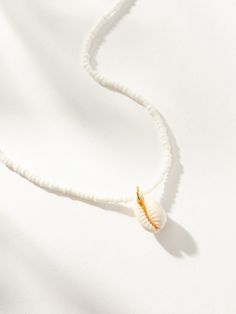 Channel your inner surfer vibes with our Beaded Puka Shell Necklace. This white beaded necklace with a puka shell pendant is the ultimate summer essential. Want to have a full beaded summer? You need all of our beaded jewelry. Cheap White Shell Necklace With Colorful Beads, Sea Shell Necklace Puka, Ablone Shell And Beaded Necklaces, Surfer Vibes, Uncommon James, White Beaded Necklace, Puka Shell Necklace, Puka Shell, Summer Essential