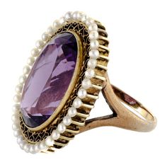 Absolutely beautiful antique impressive size amethyst pearl and 14kt yellow gold ring centrally set with one large oval shaped faceted deep vibrant purple amethyst measuring approximately 19 x 14 x 9.5mm depth with an approximate weight of 13.40 cts. surrounded by a gold wirework filigree intricate frame further accented with numerous small peg set pearls - substantial 14kt yellow gold ring mount - very good condition - hard to approximate size but somewhere around a size 7.5 - 8 can be sized - Antique Oval Amethyst Ring, Antique Oval Purple Amethyst Ring, Victorian Oval Pearl Ring With Gemstone, Victorian Style Oval Purple Amethyst Ring, Victorian Style Purple Oval Amethyst Ring, Victorian Oval Amethyst Ring With 17 Jewels, Ring Mountings, Victorian Rings, Vibrant Purple