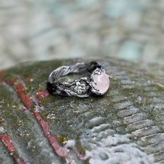 a close up of a ring on a rock