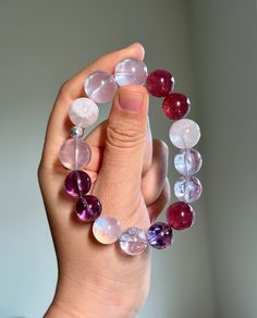 FREE SHIPPING to the US when you spend $35+ at my shop!  Size:  11-14mm Material:  Strawberry Quartz, Rose Quartz, Moonstone, Amethyst, Snowflake Phantom Quartz, 925 Sterling Silver Accessory Elevate your energy and style with my handcrafted gemstone bracelet! Only ONE availability - Order it now! You will receive the product as shown in the picture. This bracelet is suitable for wrist sizes ranging from 5.5-6 inches (14-15 cm) which is standard female size. If your wrist size falls outside this range, please inform me after purchasing, and I will adjust the beads accordingly to fit your size. Please Read: I strive to provide you with high-quality, affordable jewelry. Each piece is crafted with love and care. While I make every effort to select flawless gemstones, please note that gemstone Rose Quartz Crystal Bracelet With Natural Stones, Beaded Crystal Bracelet For Meditation, Healing Gemstone Stretch Bracelet With Round Beads, Beaded Crystal Meditation Bracelet, Round Rose Quartz Crystal Bracelet With Natural Stones, Healing Mineral Crystal Bracelet, Rose Quartz Beaded Bracelets As Gift, Spiritual Quartz Jewelry With Round Beads, Round Gemstone Beads For Gifts