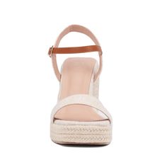 A summer style essential, the Unita espadrille sandal features platform wedge heels that provide both height and comfort. Contrasting ankle straps add a distinctive touch to the design, while polished buckle closures enhance the sandal's sophisticated appeal. Perfect for pairing with sundresses, shorts, or skirts, the Unita sandal effortlessly combines chic style with practicality. Elevate your warm-weather wardrobe with this versatile espadrille, ideal for adding a touch of elegance and ease to Summer Wedge Sandals With Heel And Ankle Strap, Trendy Straw Wedge Sandals For Summer, Beige Wedge Sandals With Heel Strap For Vacation, Beige Block Heel Wedge Sandals For Spring, Spring Espadrille Wedge Sandals, Summer Ankle Strap Wedge Sandals, Summer Wedge Heels With Removable Insole, Espadrille Wedge Sandals With Platform, Straw Wedge Sandals With Open Heel For Summer