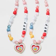 The Girls' 2pk Heart Charms BFF Necklace Set from Cat & Jack™ includes two charming necklaces with heart-shaped pendants, perfect for sharing with your best friend. With an overall length of 16 inches and a lobster claw clasp closure, these necklaces are easy to wear and secure. Made with quality zinc alloy, polyester and acrylic, these necklaces are not only stylish but also durable. Get these adorable "BFF" beads and show off your friendship in style. Cat & Jack™: Kids’ clothing with an imagin Playful Pink Charm Necklace For Friendship, Playful Pink Charm Necklaces For Friendship, Trendy Pink Charm Necklace For Friendship, Trendy Heart-shaped Necklace For Friendship, Personalized Playful Necklace For Friendship, Cute Letter Beads Necklaces For Friendship, Adjustable Cute Charm Necklaces For Friendship, Cute Adjustable Charm Necklace For Friendship, Cute Adjustable Charm Necklaces For Friendship