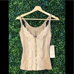 Small Nude Slimming Top 52% Elastane 48% Nylon Lace: 78% Nylon, 22% Elastane Approximately: Bust- 33cm Length- 41.5 Cm Spring Fitted Camisole With Medium Bust Support, Spring Camisole With Medium Bust Support And Stretch, Spring Camisole With Medium Bust Support, Beige Fitted Lace Camisole, Cream Lace Fitted Camisole, Spring Nylon Camisole With Built-in Bra, Elegant Beige V-neck Lace Top, Beige Lace V-neck Top, Maternity Shapewear