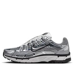 The Nike P-6000 'Metallic Silver' draws inspiration from the 2006 Air Pegasus, infusing it with futuristic flair. Its breathable metallic fabric upper features both vertical and horizontal overlays in chrome synthetic leather, creating a glistening effect. The silver side-panel Nike swoosh is outlined in black embroidery, complementing the black foxing and Nike branding on the tongue tag and heel tab. White laces match the tongue, sock liner, and insole, adorned with P-6000 branding. The comfort Nike P6000, P 6000, Trendy Shoes Sneakers, Silver Sneakers, Nike Models, Baskets Nike, Nike Pegasus, Limited Edition Sneakers, Style Sportif