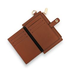 Our cognac mini leather wallet is functional and stylish. Zippered coin pouch 6 card slots 3 slip pockets Ring to attach keys or lanyard Size: 5.5"w x 3.5"h Materials: faux leather Care Instructions: Wipe with Damp Cloth Vendor: Demdaco Versatile Brown Wallet With Card Slots, Brown Travel Card Holder With Key Clip, Brown Rectangular Coin Purse With Key Clip, Brown Leather Card Holder With Zipper, Versatile Brown Wallets With Interior Card Slots, Rectangular Brown Coin Purse With Key Clip, Brown Leather Card Holder With Zipper Closure, Brown Card Holder With Key Clip For Daily Use, Versatile Brown Wallet With Zipper Closure