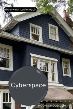 a blue house with the words cyberspace painted on it