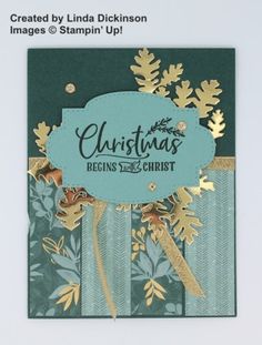 a christmas card with gold foil and green paper on the front, featuring an image of trees