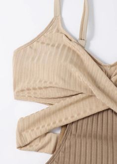 This exquisite bodysuit offers a unique blend of sophistication and charm with its classy beige stripes and patchwork design. The backless style adds a touch of allure to this luxurious swimwear piece.Fabric: Cotton BlendedSize & Fit:high stretchHand Wash Cold. Elegant Seamless Beige Bodysuit, Elegant Beige Seamless Bodysuit, Chic Beige Lined Bodysuit, Chic Striped Fitted Bodysuit, Chic Fitted Striped Bodysuit, Stretch Beige Bodysuit For Night Out, Beige Stretch Bodysuit For Night Out, Beige V-neck Bodysuit For Spring, Spring Beige V-neck Bodysuit