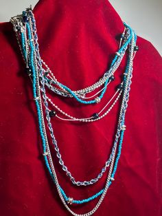 Lia Sophia 5 strand of beads which can be removed from the clasp and worn in different ways for layering. Silvertone chains, black beads, turquoise beads, silvertone beads. Silver Multi-strand Beaded Chain Beads, Blue Beaded Multi-strand Layered Necklace, Blue Multi-strand Beaded Layered Necklace, Turquoise Beaded Multi-strand Layered Necklace, Turquoise Beaded Multi-strand Necklace, Multi-strand Metal Beads Jewelry, Silver Multi-strand Beaded Necklaces With Spacer Beads, Silver Multi-strand Beaded Necklace With Spacer Beads, Silver Multi-strand Bohemian Beads