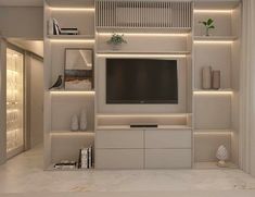 an entertainment center with built in shelving and lighting