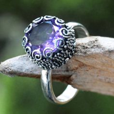 Ornate and lovely this silver cocktail ring exemplifies modern Balinese jewelry trends. Yus Swarmana's design suggests the moon enhanced with amethyst's sparkling beauty. The gemstone weighs a generous 3 carats. .925 Sterling silver Rings Purple, Amethyst Cocktail Ring, Single Stone Ring, Silver Cocktail, Purple Amethyst Ring, Purple Jewelry, Sparkle Jewelry, Big Rings, Amethyst Jewelry