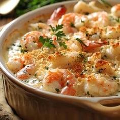 a casserole dish filled with shrimp and cheese