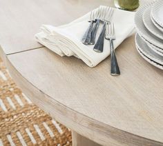 a table with plates and silverware on it