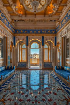 an ornately decorated room with blue and gold decor on the walls, windows, and floor