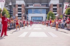 a group of cheerleaders marching down the street