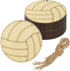 three wooden coasters with rope around them and one has a volleyball ball on it