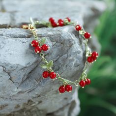 This Cranberry Bracelet is sure to make a statement. Crafted from lustrous alloy, this piece is the perfect touch of sophisticated glamour. Its bold cranberry hues will add a splash of vibrancy to your look and will surely be admired. >>  See   More   Orchard   Jewelry   Collection. DETAILS Plating: 18K Gold Materials: 18K Gold on Brass, Mother of Pearl Measurements: Length: 6.69"(17cm) + Extender: 2.76"(7.0cm) Weight:  12.36g There will be a little difference among different production batches Fruit Bracelet, Diamond Star Necklace, Star And Moon Necklace, Unique Gift Wrapping, Diamond Evil Eye, Beaded Leaf, Chunky Bracelet, Lucky Bracelet, Evil Eye Earrings