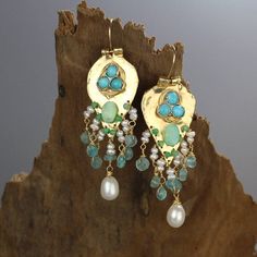 Turquoise Statement Earrings, Something Blue, Gold Filled Gemstone Earrings, Turquoise Earrings, Unique Gift for Mom, Birthstone EarringsTurquoise Sherazade earrings are made of organic gold filled shaped like a knight shield set with three natural turquoise gemstones.The earrings have a strong spiritual meaning and meant to protect its wearer.A unique setting of bezel set turquoise gemstones on the gold filled shield, and a beautiful handwoven cluster of pearls, apatite, jade and Peruvian pearl Turquoise Dangle Earrings With Gemstone Accents, Bohemian Turquoise Earrings With Gemstone Accents, Turquoise Drop Earrings With Gemstone Accents, Turquoise Gemstone Drop Earrings, Handmade Turquoise Earrings For Wedding, Green Natural Stone Earrings For Wedding, Green Natural Stones Earrings For Wedding, Teardrop Multi-stone Earrings For Wedding, Teardrop Multi-stone Wedding Earrings