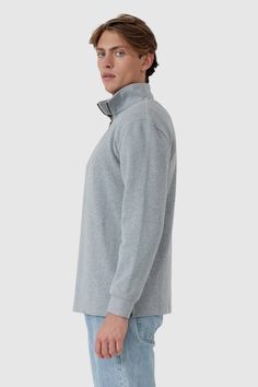 Introducing the Kellock Ribbed Quarter Zip, a transeasonal and timeless piece in our most premium fabric offering yet. Made from a super soft, finely ribbed cotton and polyester blend. This versatile sweater combines perfectly with jeans, or pair it with chinos for a relaxed smart-casual look. 95% Cotton, 5% Polyester ribbing Grey marle garment wash Embroidered ORTC logo on cuff Ribbed cuffs with a split hemline Brass coloured zipper Designed in Australia. Made in China Versatile Sweater, Twill Pants, Smart Casual, Mens Bottom, Timeless Pieces, Quarter Zip, Casual Looks, Split, Cuff