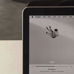 an image of a person jumping in the air on their cell phone and playing music